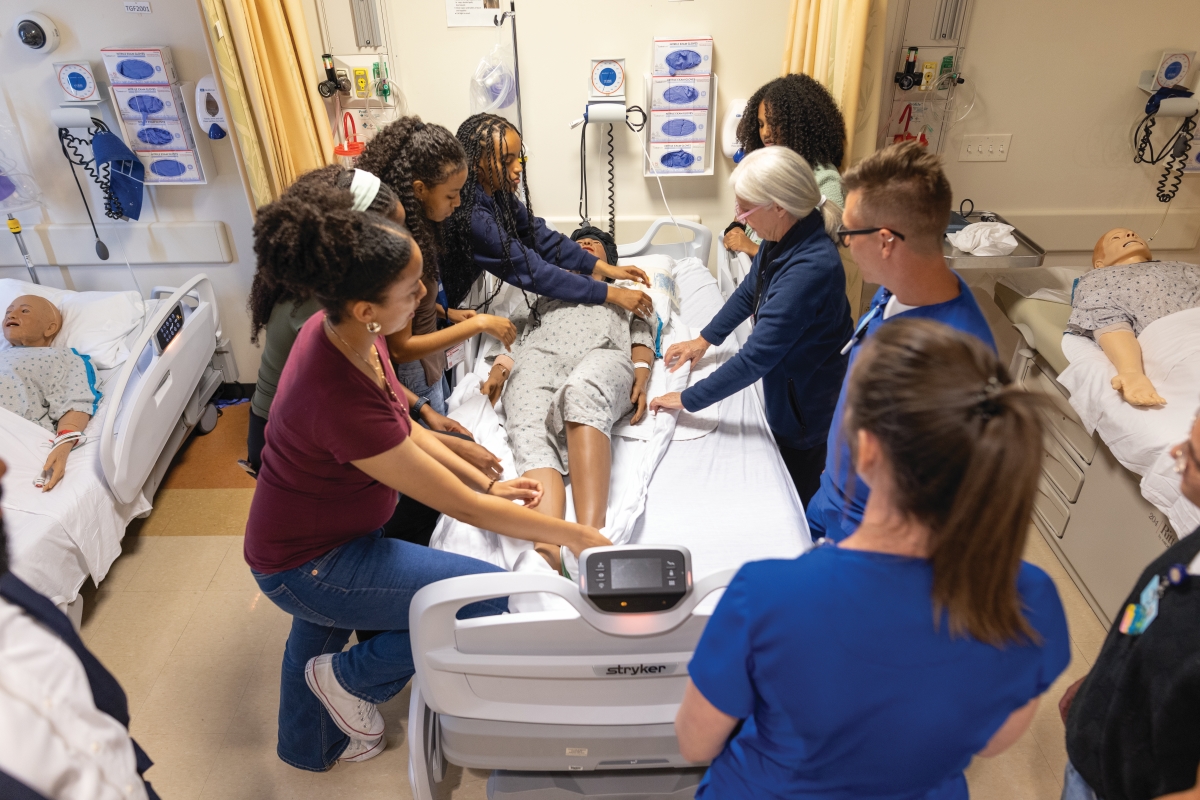 BESt students get hands-on experience using the state-of-the-art simulation lab at Barnes-Jewish College Goldfarb School of Nursing alongside nursing student ambassadors.